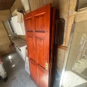 Wooden door with reddish-brown finish