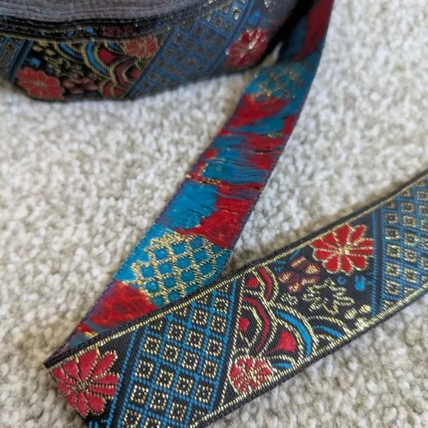 Roll of embroidery ribbon with gold thread