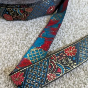 Roll of embroidery ribbon with gold thread