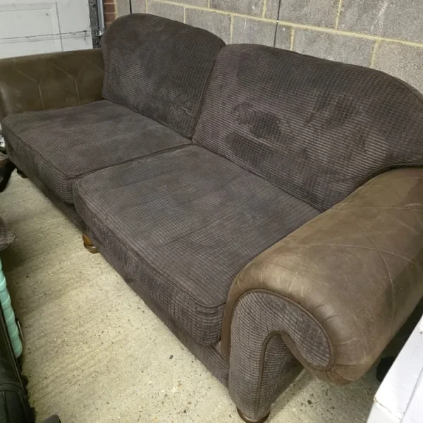 Brown Chesterfield sofa and chair