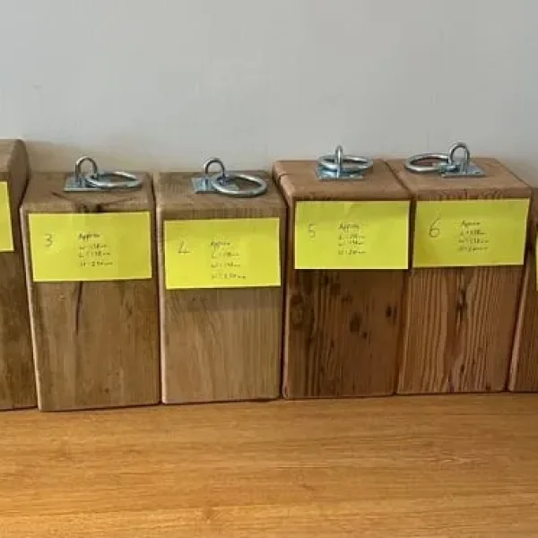 Handmade wooden doorstops from old workbench legs
