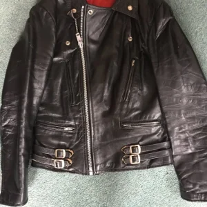 Women's leather motorbike jacket and trousers size 12