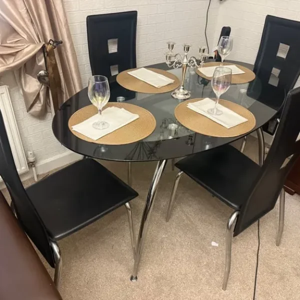 Glass dining table with four chairs