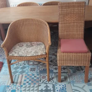 Large oval dining table with 8 rattan chairs