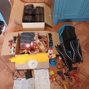 Vintage Scalextric cars and track pieces