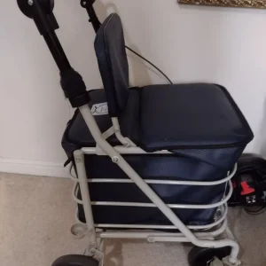 Shopping trolley/walker with cushioned seat