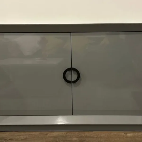Dark grey metal cabinet with two doors and shelves