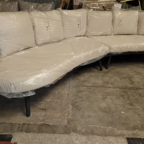 Garden sofa with curved modular design and rattan weave