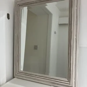 Cream distressed framed mirror