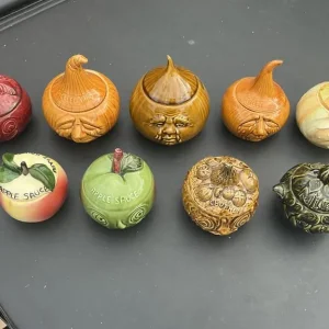 Nine condiment pots including two Sylvac