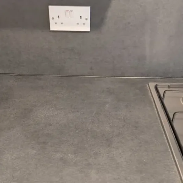 Slate effect splashback and breakfast bar