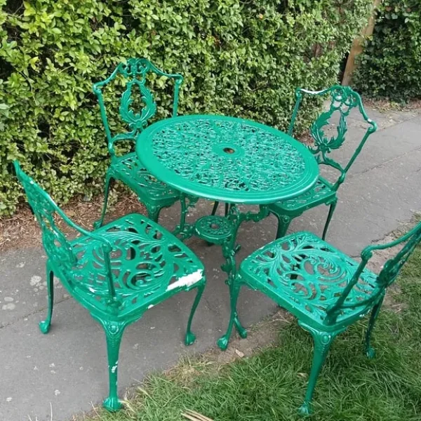 Cast alloy garden table and four chairs