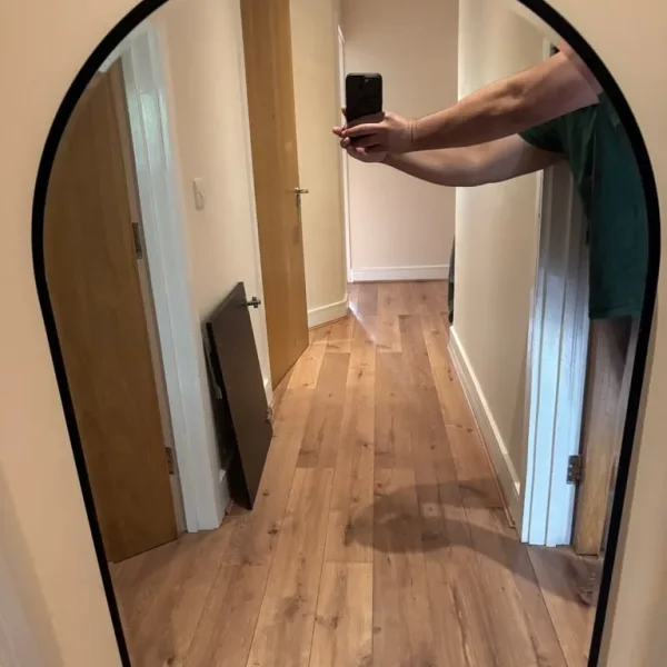 Arched black mirror