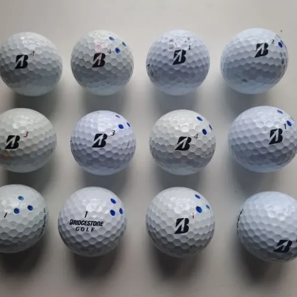 12 Bridgestone golf balls 11 tour models 1 soft ball