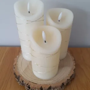 3 cream gold battery candles wood log stand
