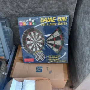 Dart board new and sealed comes with 2 sets of darts