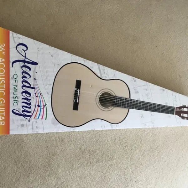 Child’s guitar by Academy