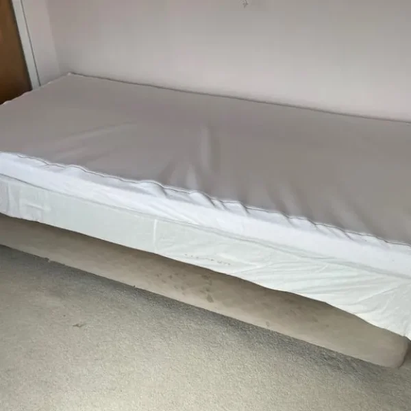 Single bed with topper