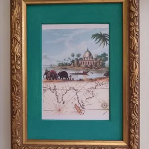 Framed picture in ornate gold frame
