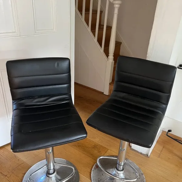 Two swivel bar stools