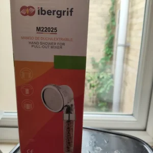 Shower head with filter and beads