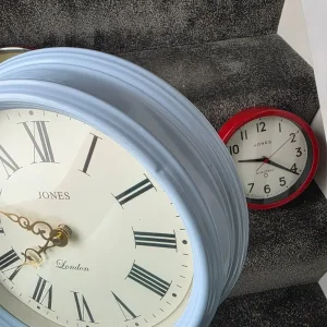 Quartz red wall clock with small mark and dent - Image 3