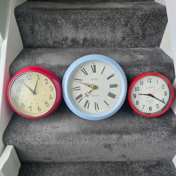 Quartz red wall clock with small mark and dent
