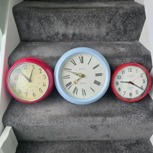 Quartz red wall clock with small mark and dent