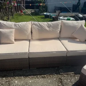 Large rattan sofa with footstool and storage table - Image 2