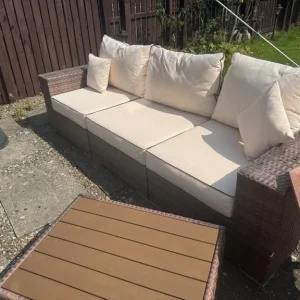 Large rattan sofa with footstool and storage table - Image 5