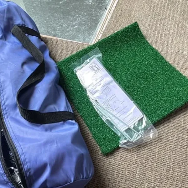 PGA Tour practice net with chipping mat