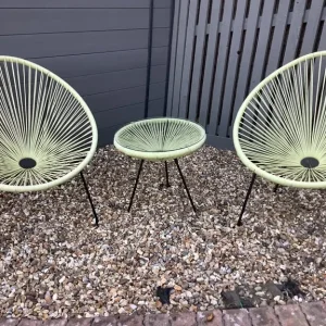 Rattan Egg String Chairs and Clear Glass Table