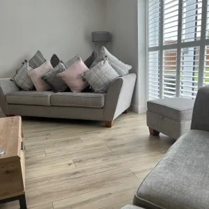 2 four seater sofas with footstool and cushions