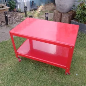 Red coffee table on wheels