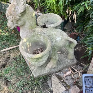 Stone ornaments and cast iron cauldron
