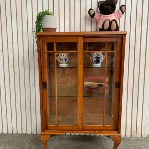 Edwardian display cabinet with sliding glass doors and glass shelves