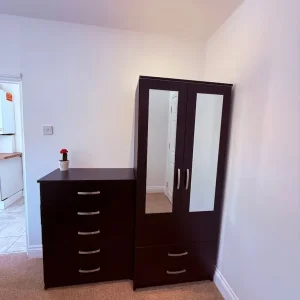 Black wardrobe and four chest of drawers