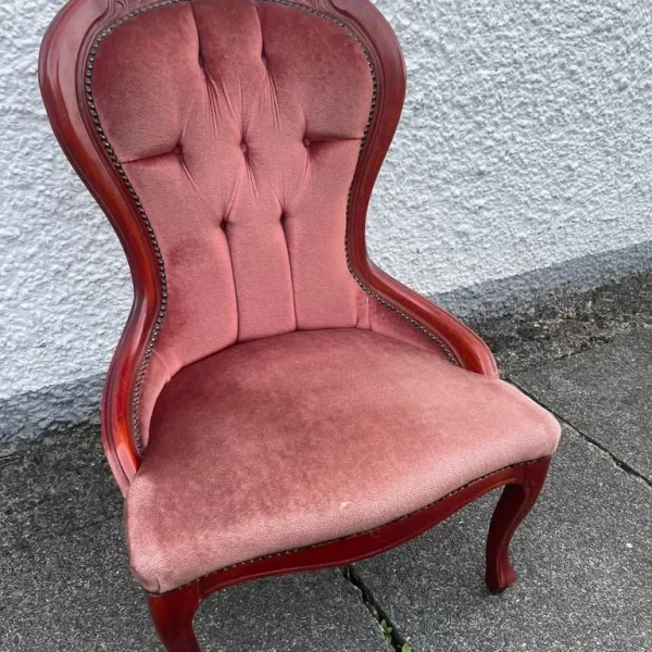 Pink button-backed chair
