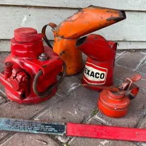 Vintage oil cans and car jack