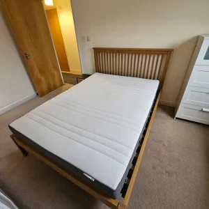 Wooden bed with double mattress