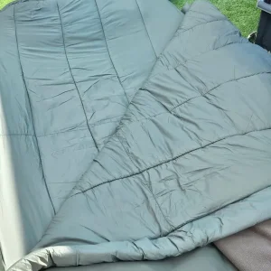 Carp fishing setup with rods, barrow, and gear - Image 2
