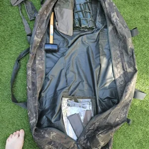 Carp fishing setup with rods, barrow, and gear - Image 7