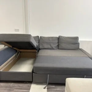 Grey IKEA Friheten L-shaped sofa bed with storage