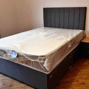 Double divan bed with panel line headboard and mattress