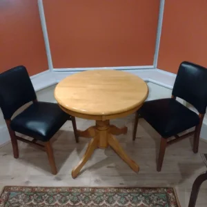 Round wooden dining table with 2 chairs