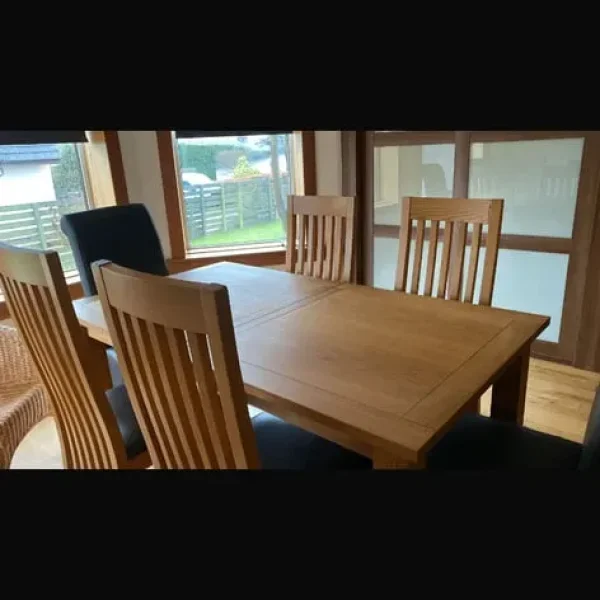 Solid oak dining table and 8 chairs