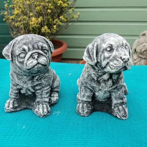 Concrete small dog statues