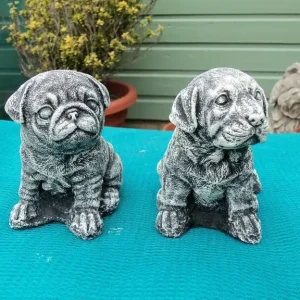 Concrete small dog statues
