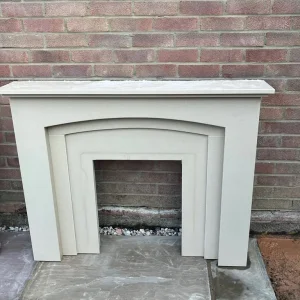 Cream marble fireplace mantle and hearth