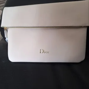 Dior makeup and clutch bag